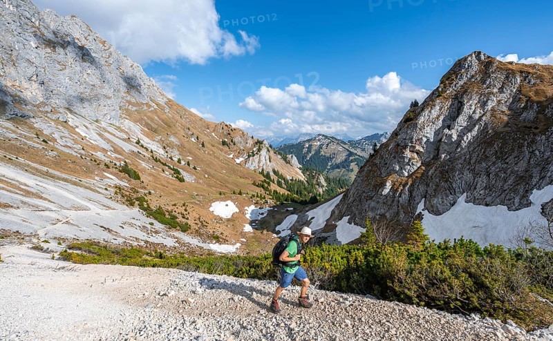 Hiker on hiking trail to the Rote Flueh