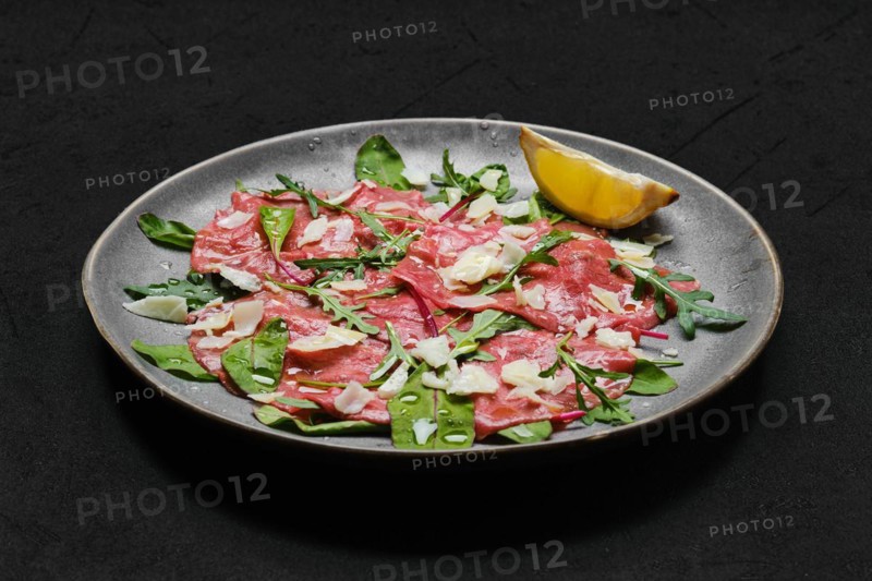 Marbled beef carpaccio with arugula and chard leaves
