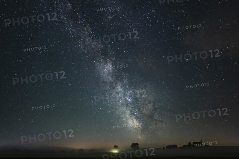 Church of St. Alban with village of Goerwangs and Milky Way with starry sky