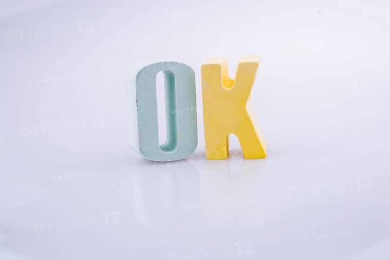 The word OK written with colorful letter blocks