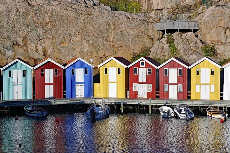 Colourful boathouses and storage sheds in the harbour of the fishing village