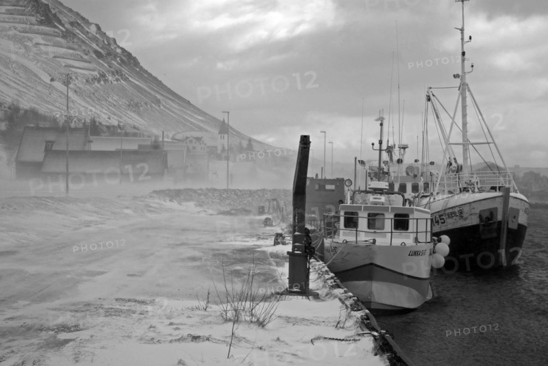 Fishermen lying at the harbour on a stormy day