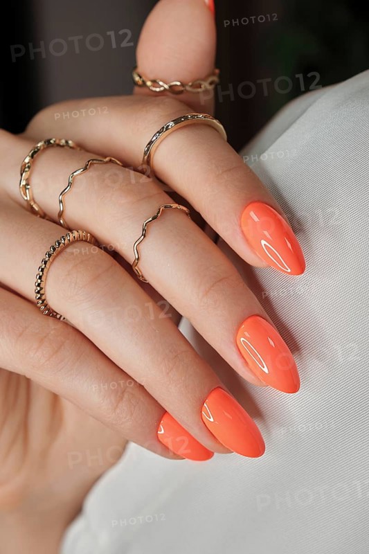 Bright neon manicure on female hands with accessories. Nail design. Beauty hands
