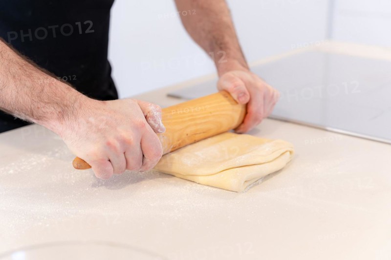 Man baking homemade croissants