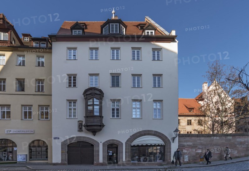 Historic residential and commercial building with a small choir