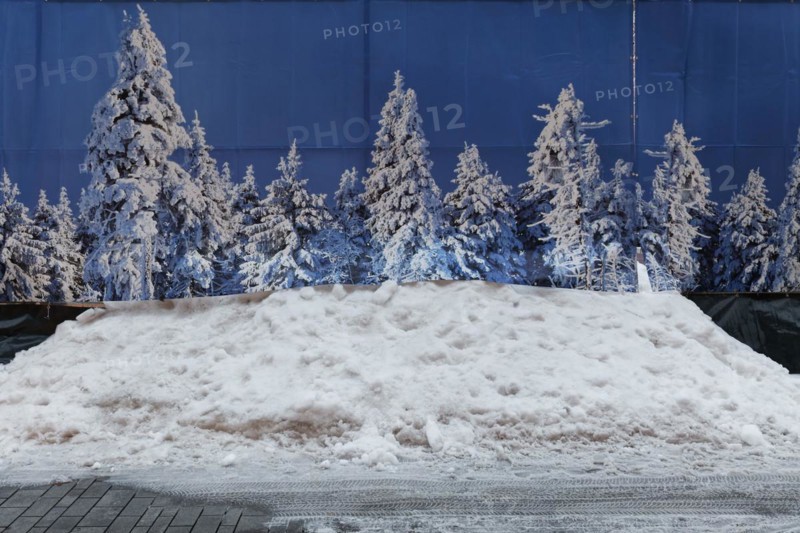 Privacy fence with photo of snow-covered fir trees