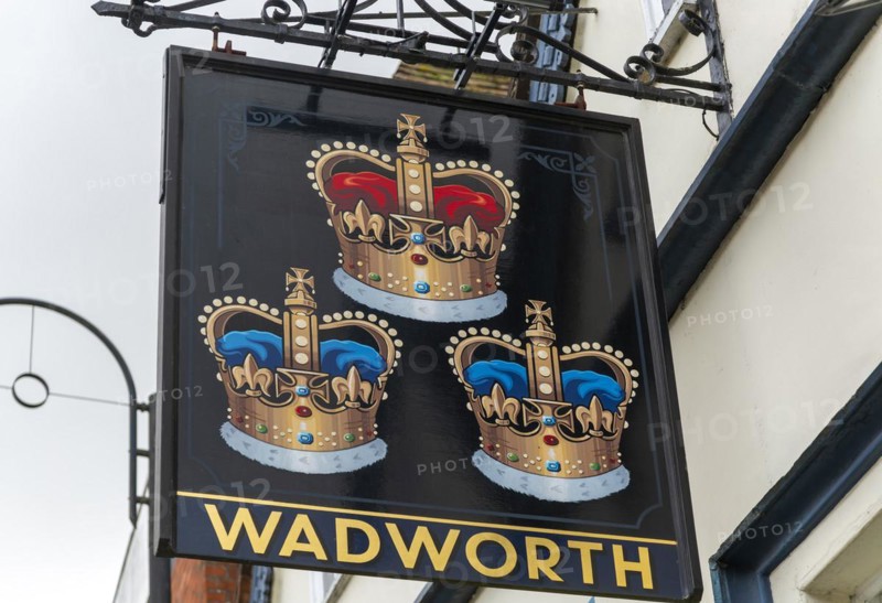 Pub sign for Wadworth brewery Three Crowns inn