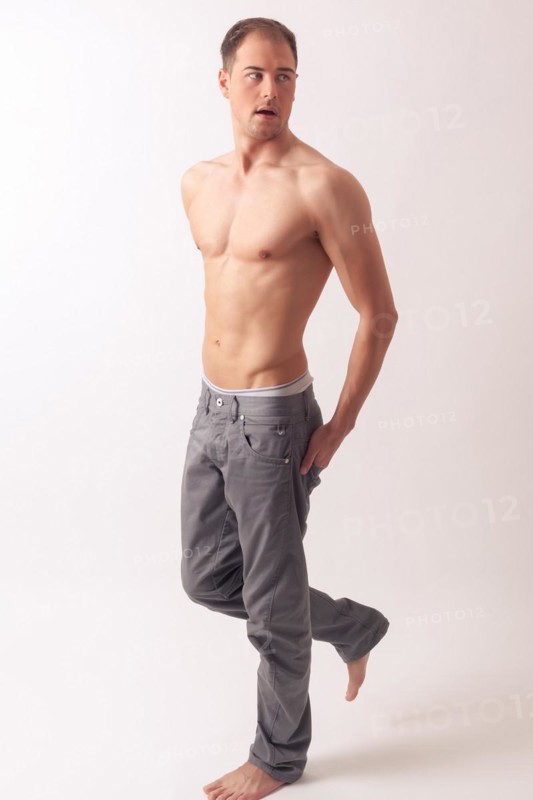 Athletic balanced man with a strong physique