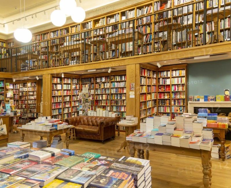 Bookshelves and piles of books
