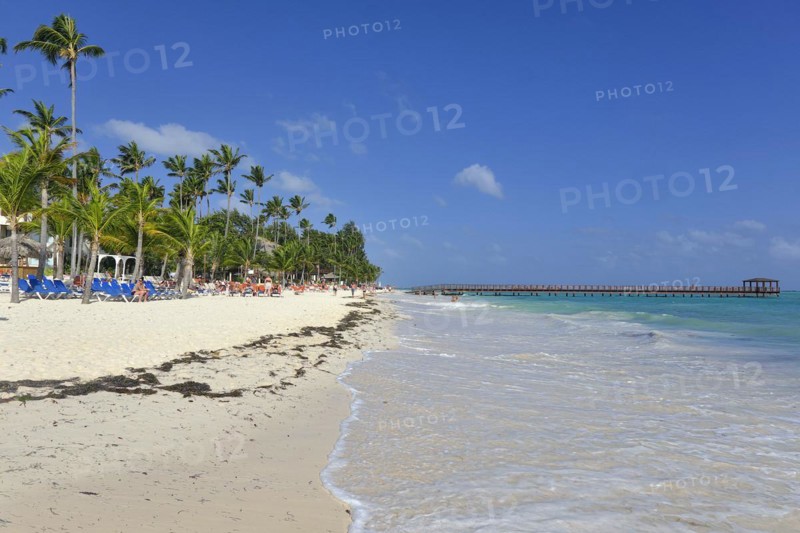 Dirty beach with jetty out to sea