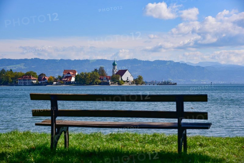 View of the Catholic parish church of St. George on the peninsula in moated castle on Lake Constance