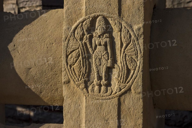 Round motif depicting a woman