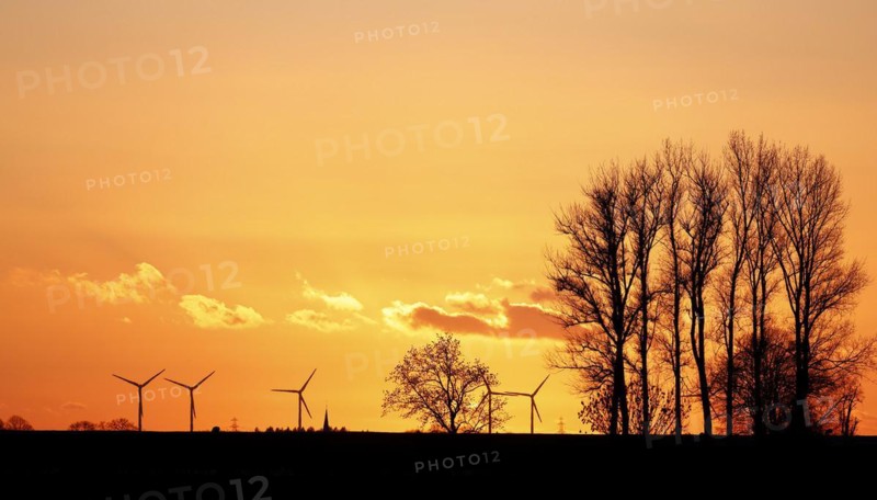 Dramatic evening sky with sunset over the Elbe dike