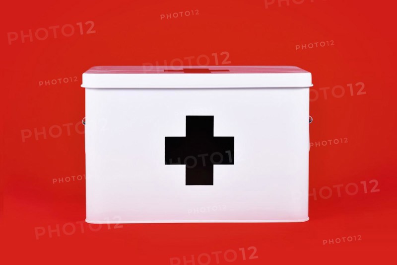 White first aid kit with black cross on red background
