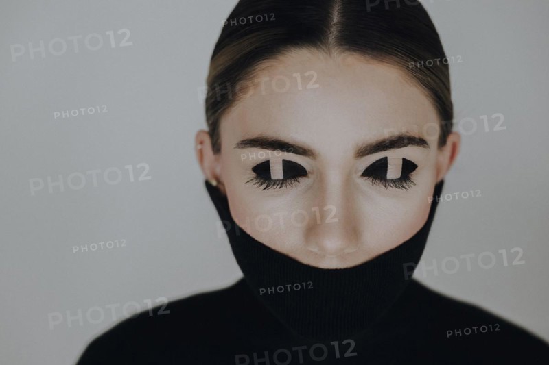 Woman with closed eyes and special eye make-up