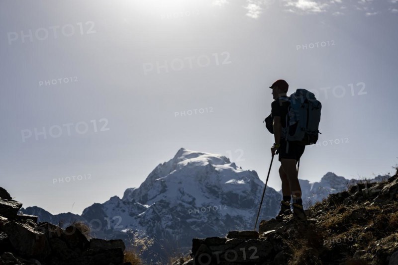 Mountaineers in the backlight in front of the Ortler summit massif
