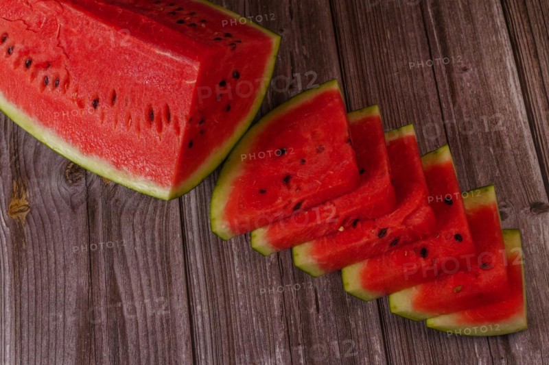 Close-up of fresh watermelon slices on a wooden table