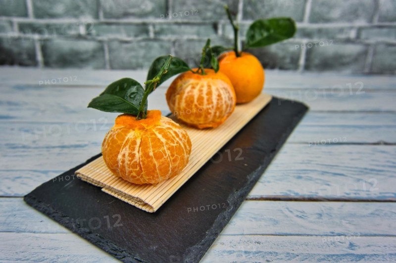 Fresh tangerines sweet clementines with drops of water