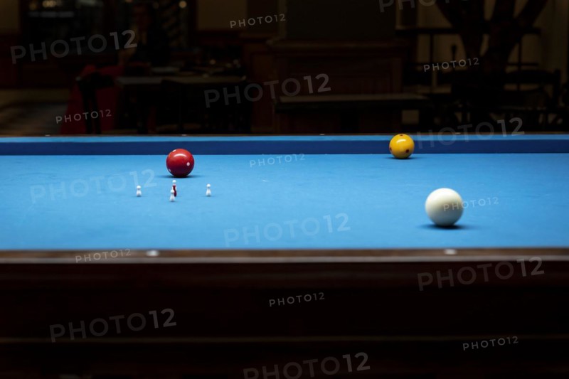 Billiard balls on a billiard table