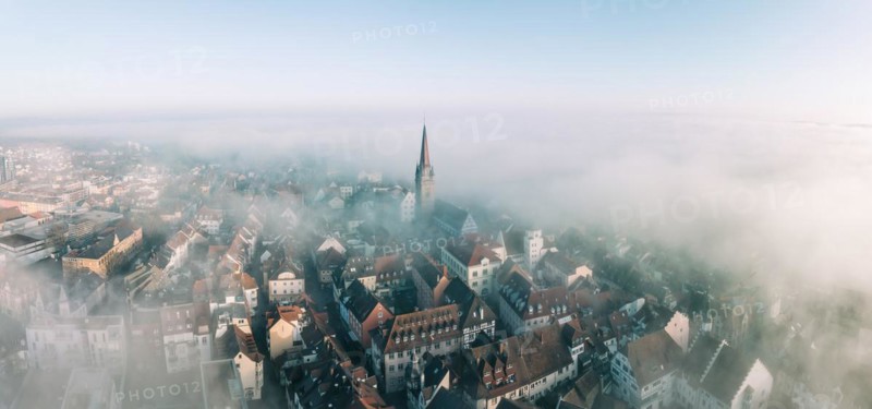 Swathes of fog drift over the old town of Radolfzell on Lake Constance