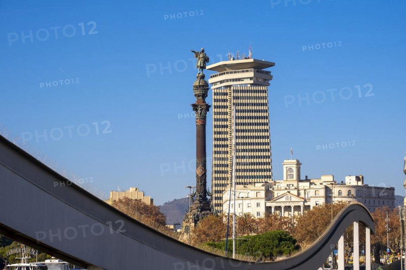 Columbus Monument at the end of Las Ramblas seen from Ramblas del Mar in Port Vell in Barcelona in Catalonia Spain