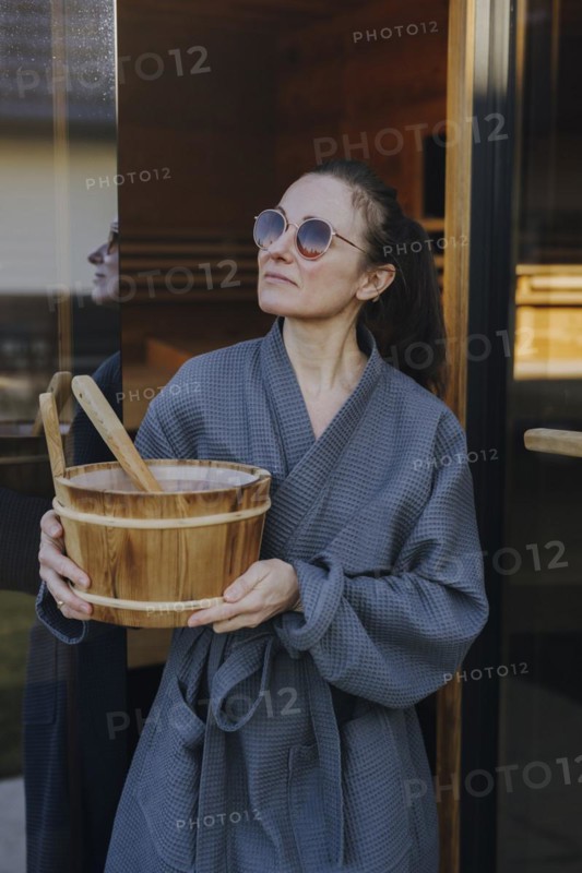 Woman taking a sauna