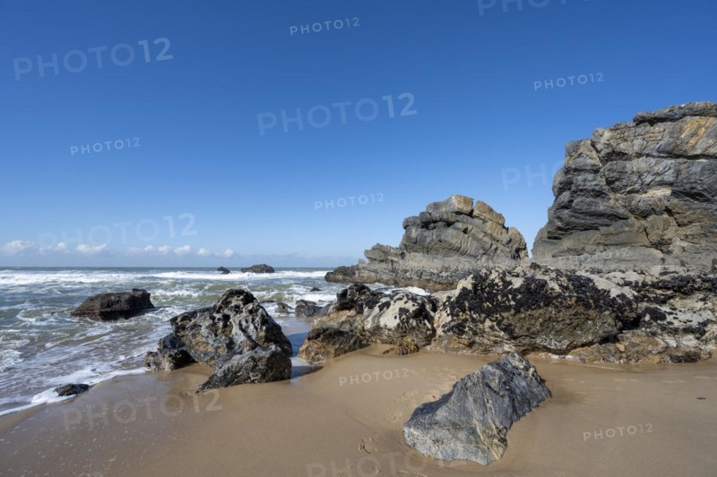 Rocky coast and sandy beach at Praia da Adraga