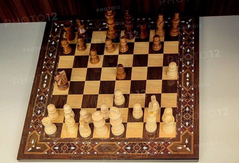 Chess board with chess wooden pieces