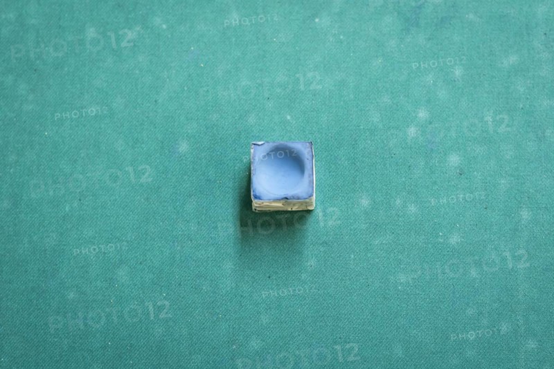 A snooker chalk on a pool table