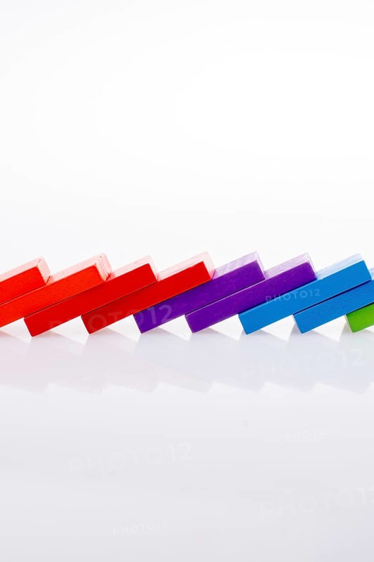 Colorful Domino Blocks in a line on a white background