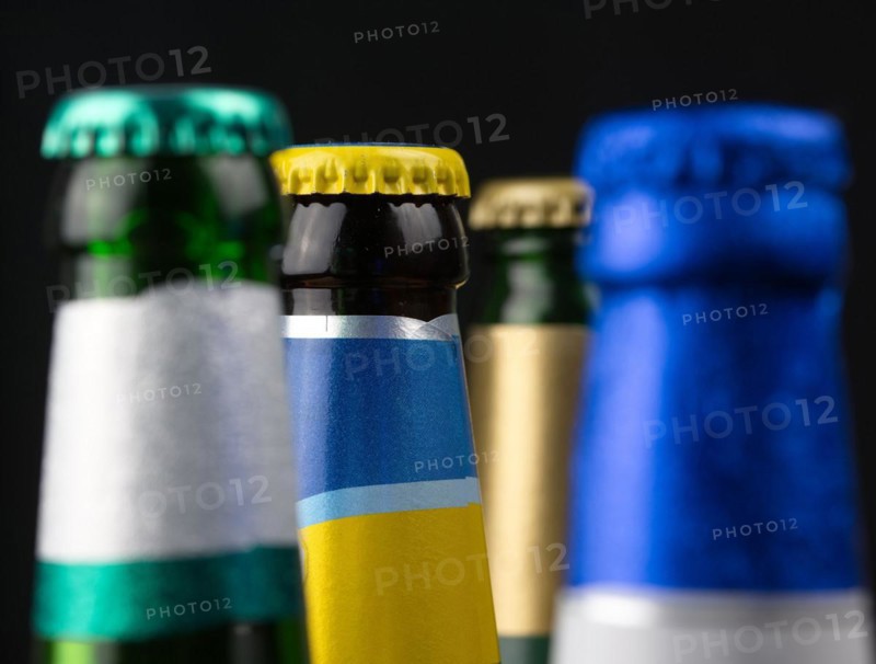Beverage bottles with crown caps in various colours