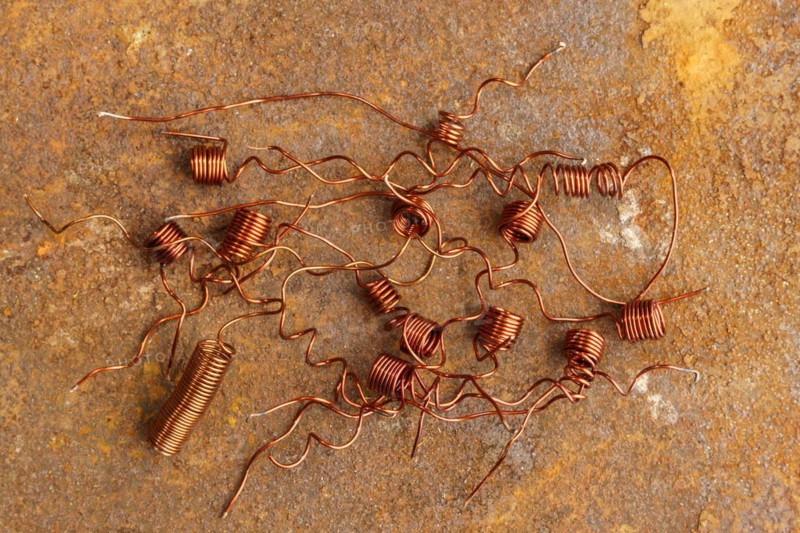 Red metal copper wire scrap materials recycling of waste from manual wire tearing. Closeup of copper waste in the form of copper wires