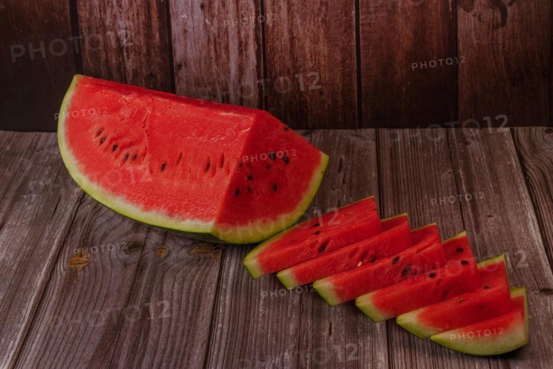 Close-up of fresh watermelon slices on a wooden table