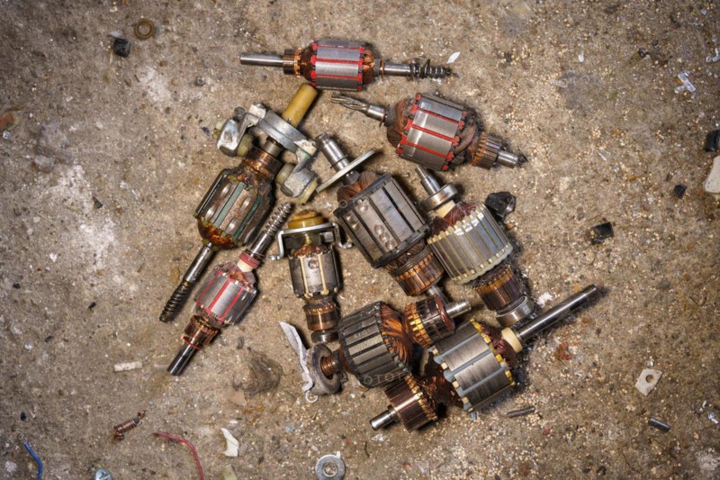 Old coils taken out of electric motors. Recycling of steel waste