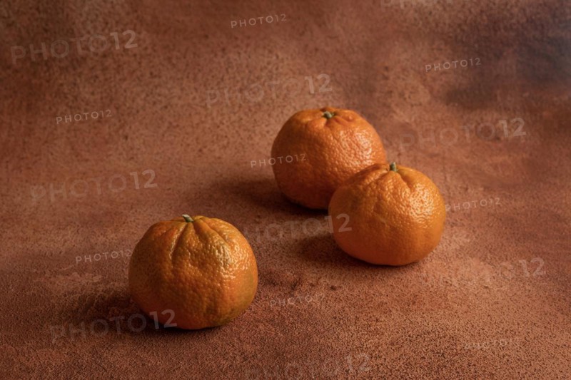 Tangerines on orange background