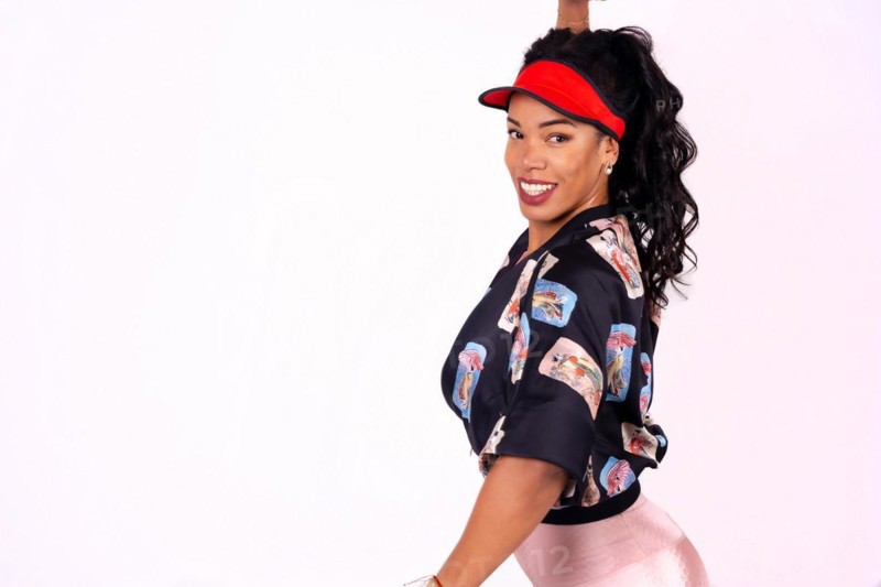 Black ethnic woman smiling dancing on a white background