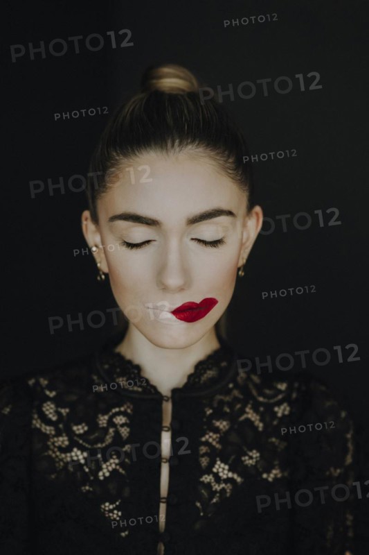 Woman with staggered red lips