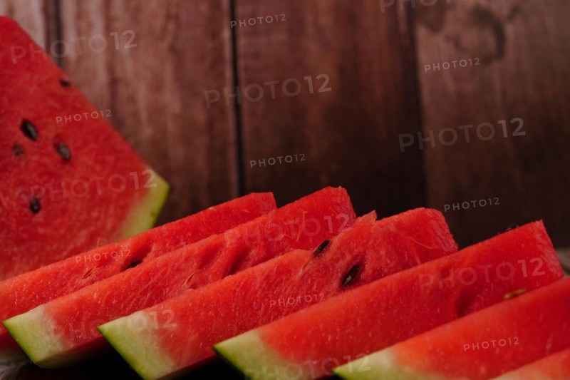 Close-up of fresh watermelon slices on a wooden table