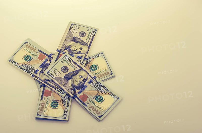 American 100 dollar banknote bundles placed on white background