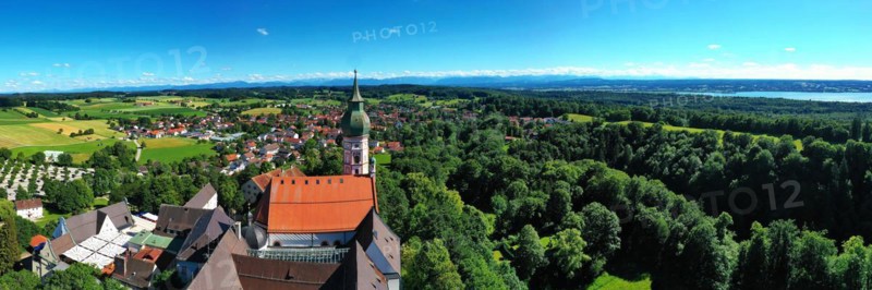Aerial view of Andechs Monastery with the Alps in the background. Andechs