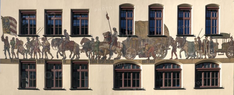 Historical mural of a medieval merchant procession