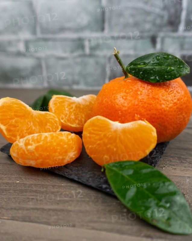Fresh tangerines sweet clementines with drops of water