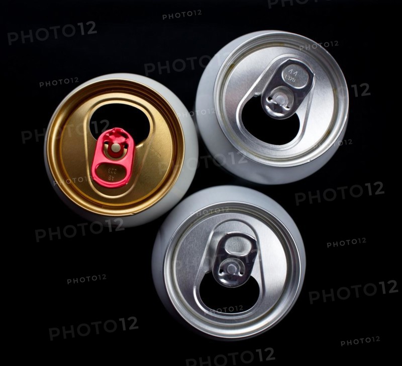 Three opened beer cans