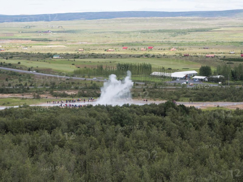 Tourists watch eruption