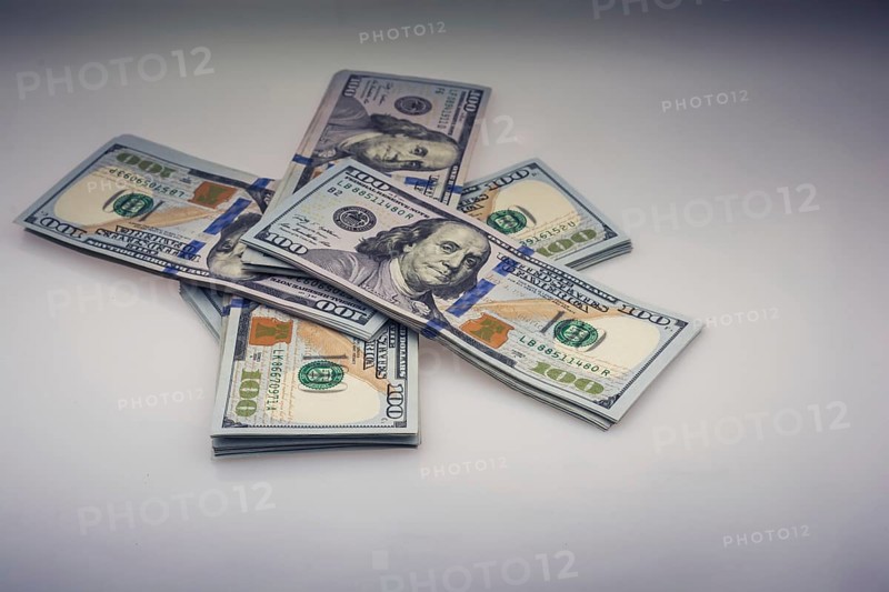 American 100 dollar banknote bundles placed on white background