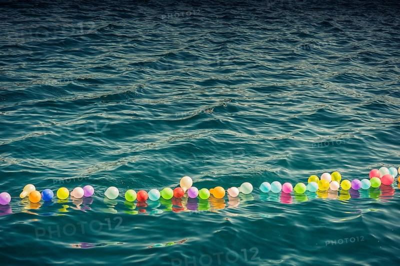 Balloon on a string on water for shooting game