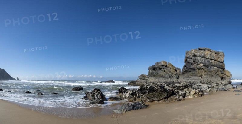 Rocky coast and sandy beach at Praia da Adraga