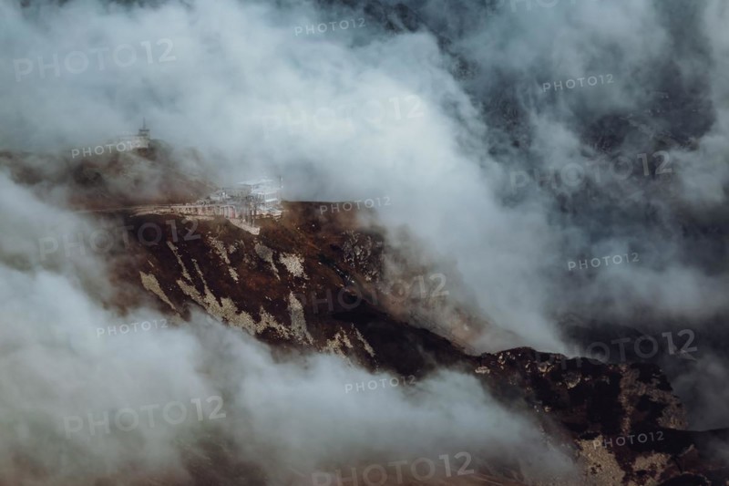 The upper station of the cable lift on Kasprowy Wierch exposed by clouds for a fraction of a second