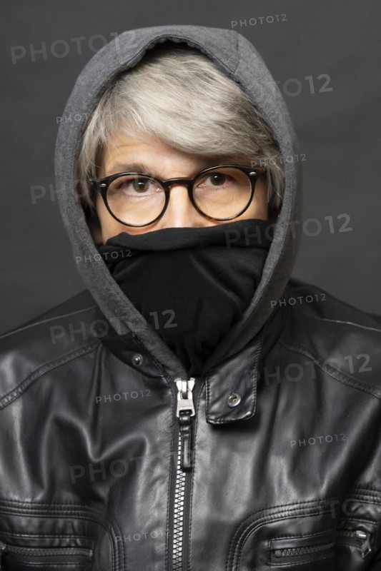 Older man with mask and winter outfit