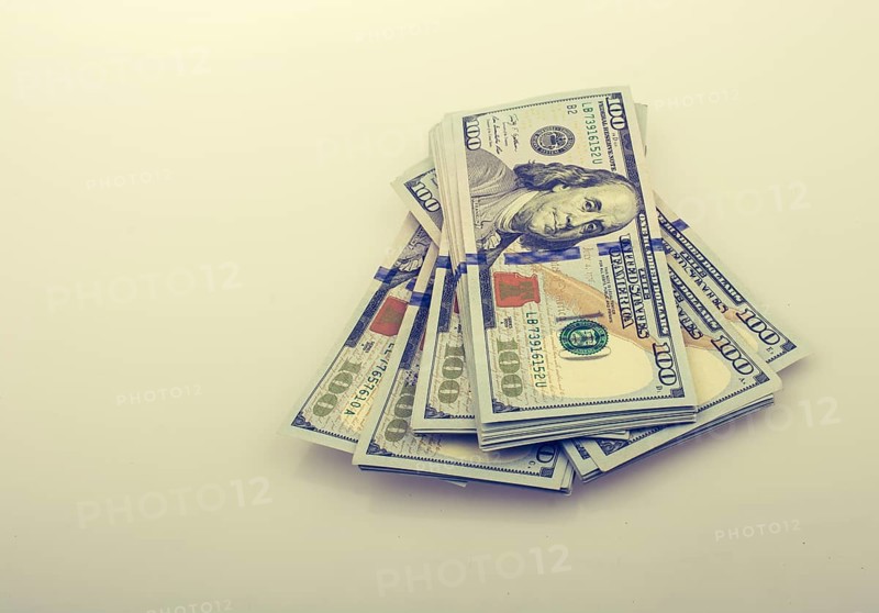 American 100 dollar banknote bundles placed on white background